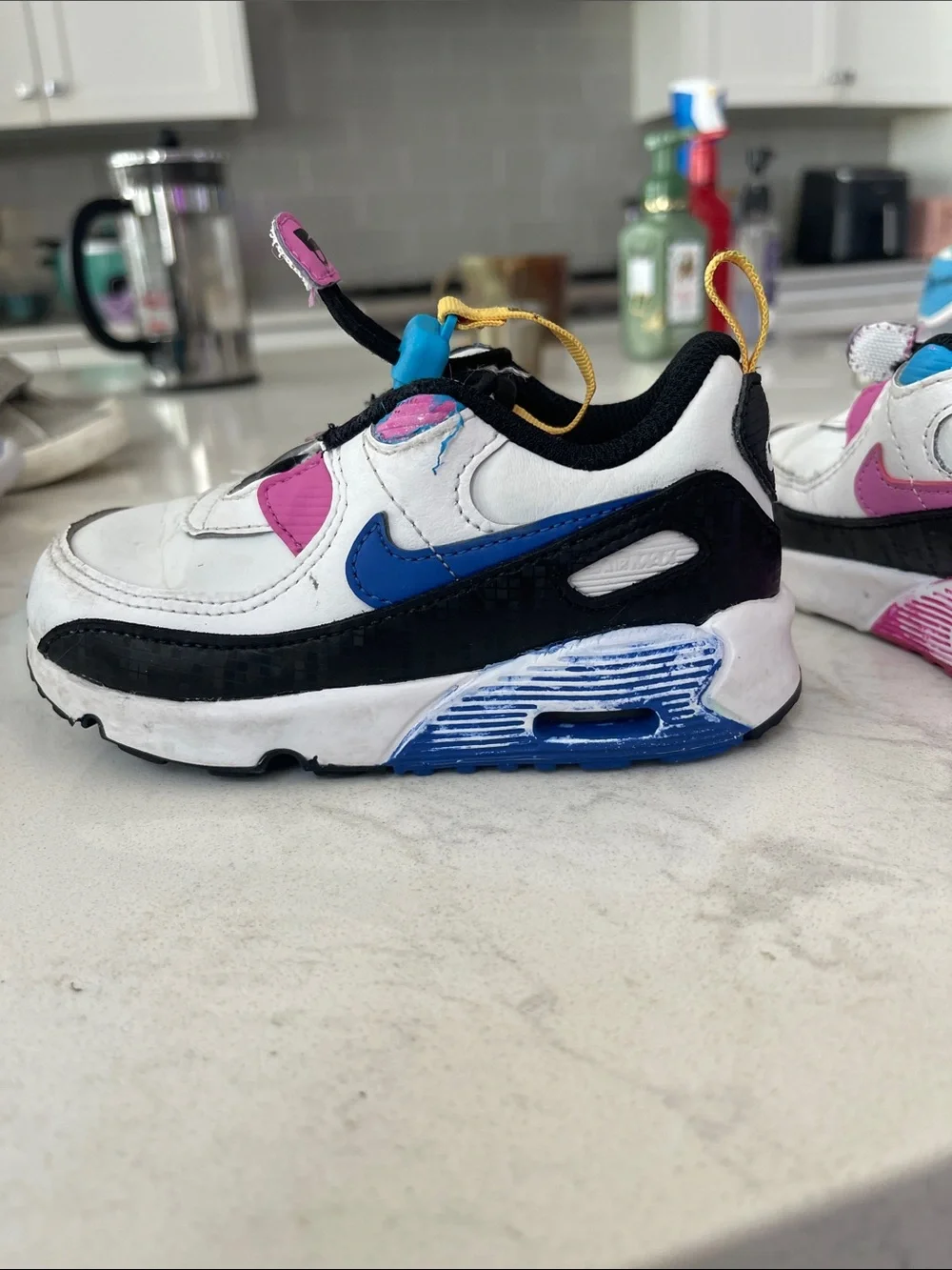 Nike White Kids Sneakers with Pink, Blue & Yellow Accents